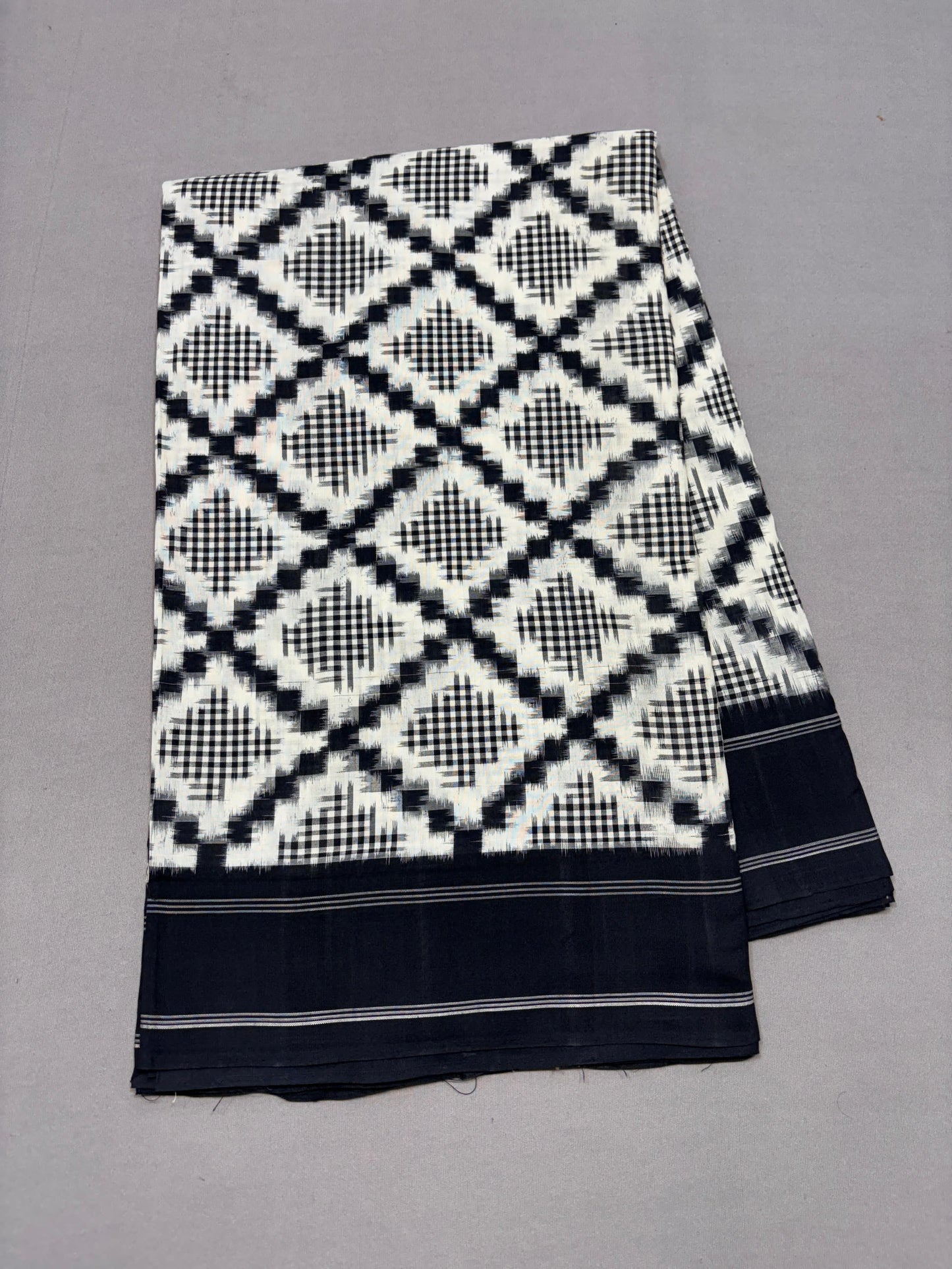 Black and white telia rumal ikkat cotton sarees