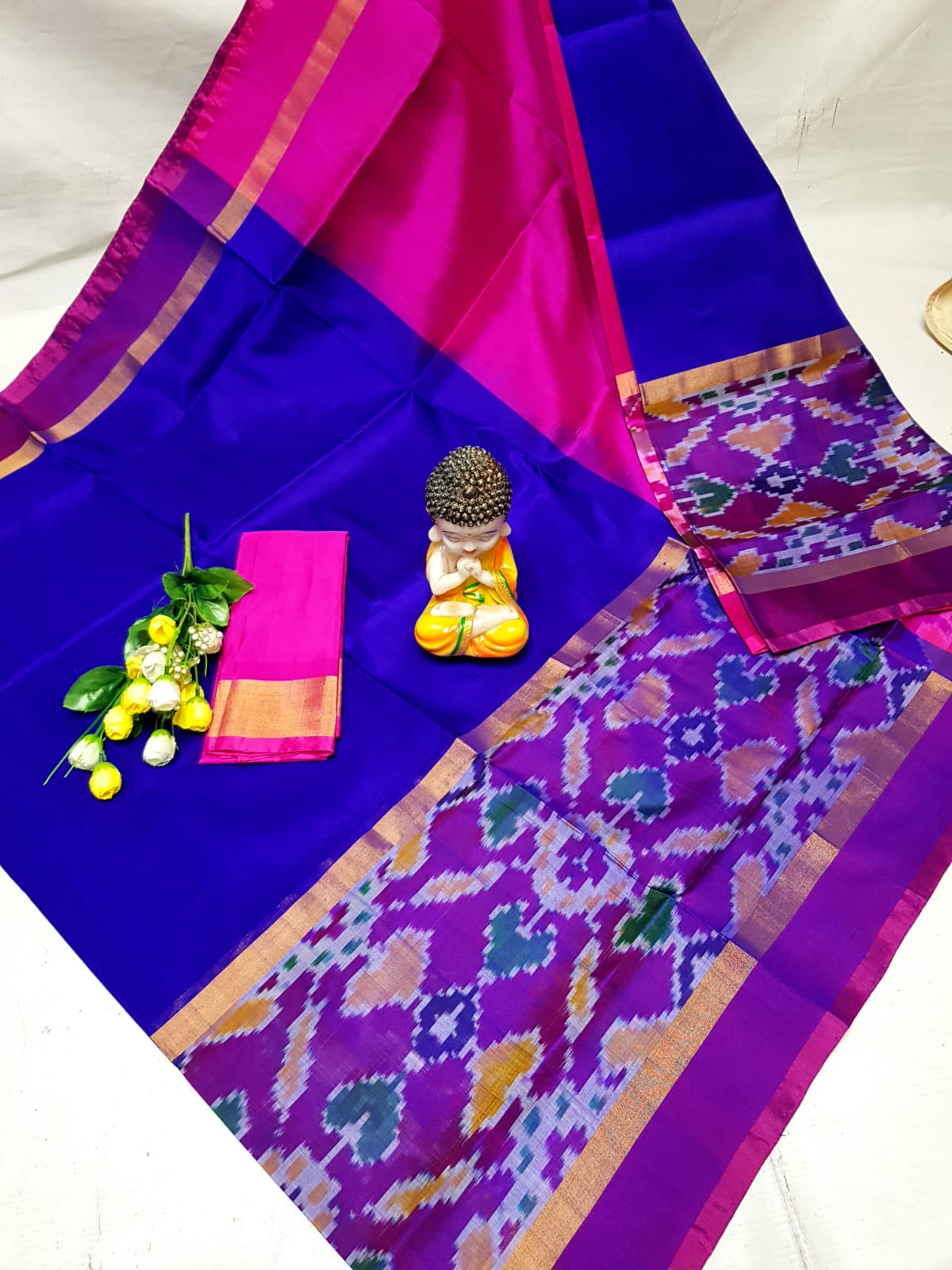 Dark blue and pink Uppada sarees with big pochampally border