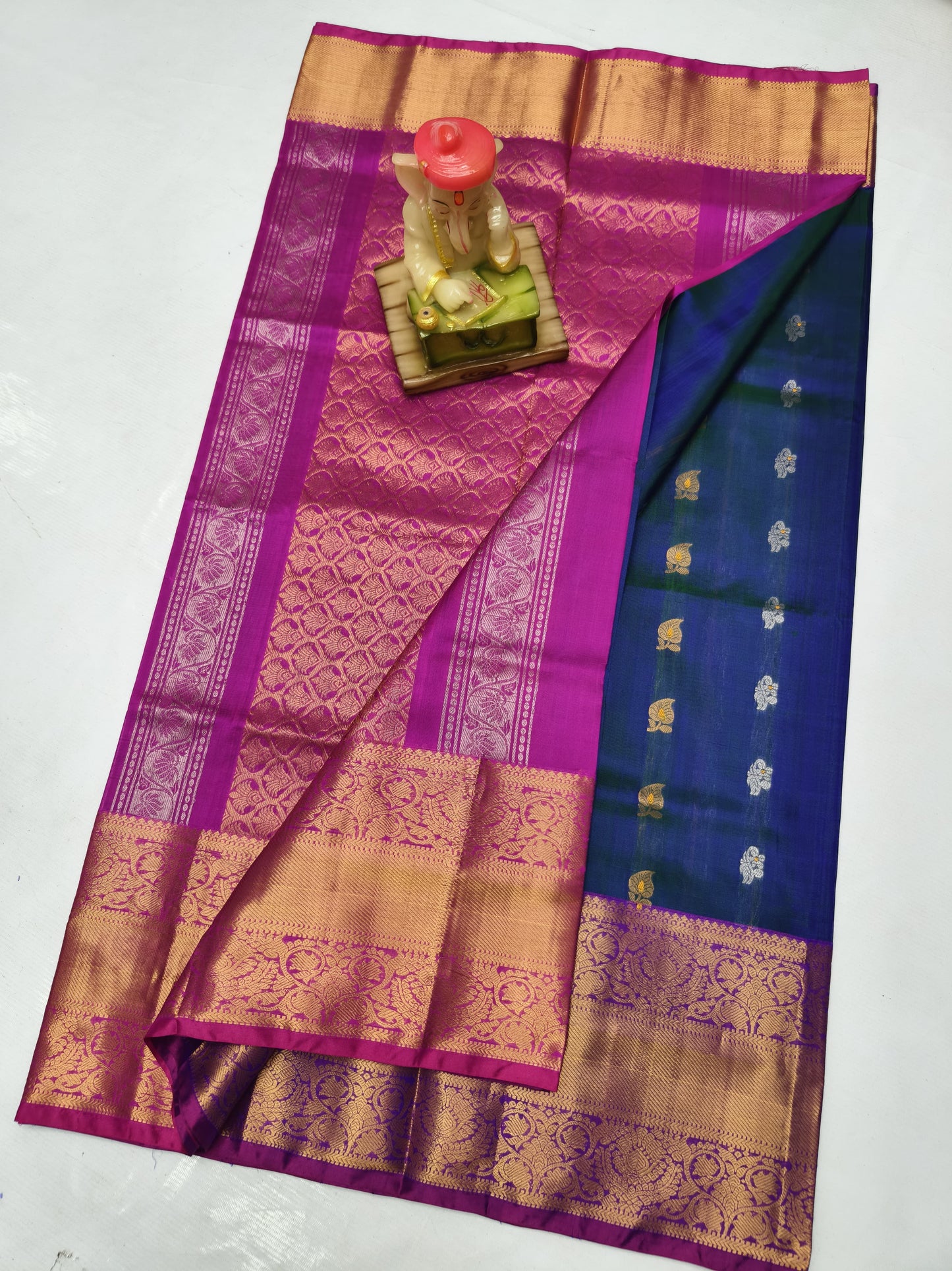 Navy blue uppada silk sarees with kanchi border