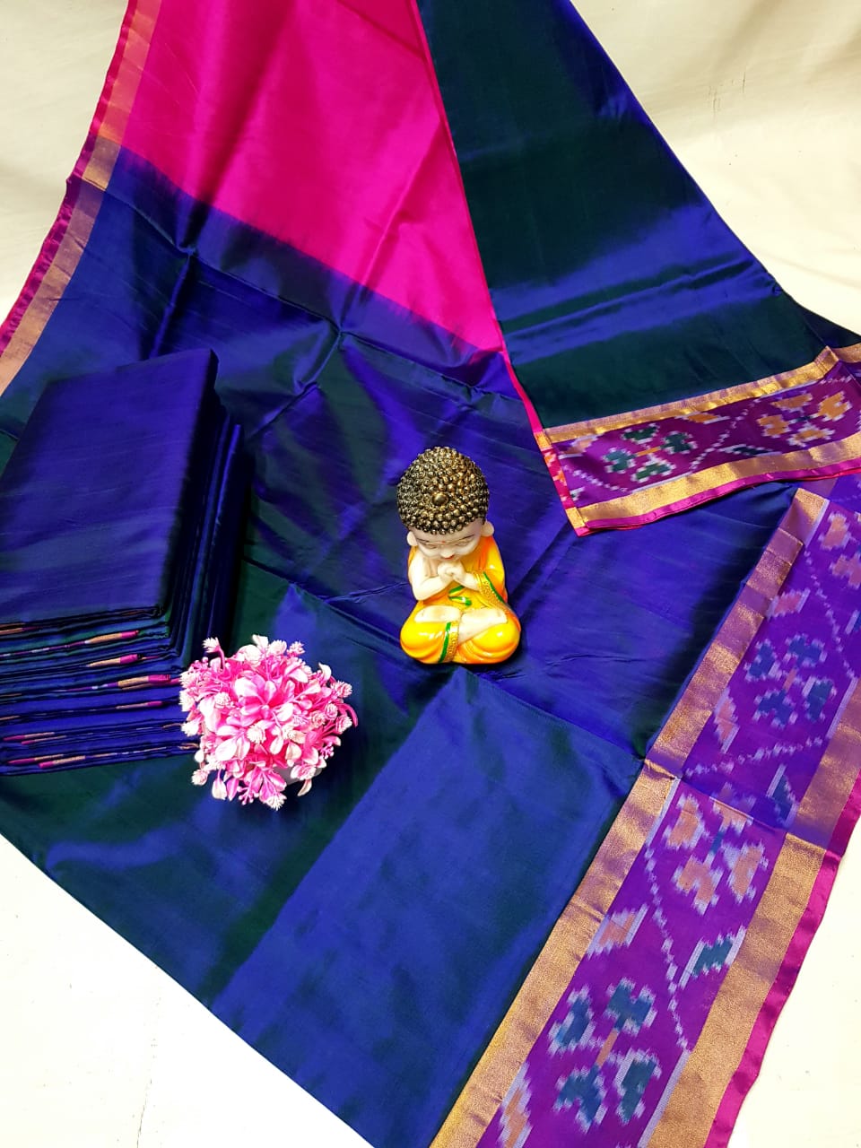 Navy blue and pink Uppada sarees with small pochampally border