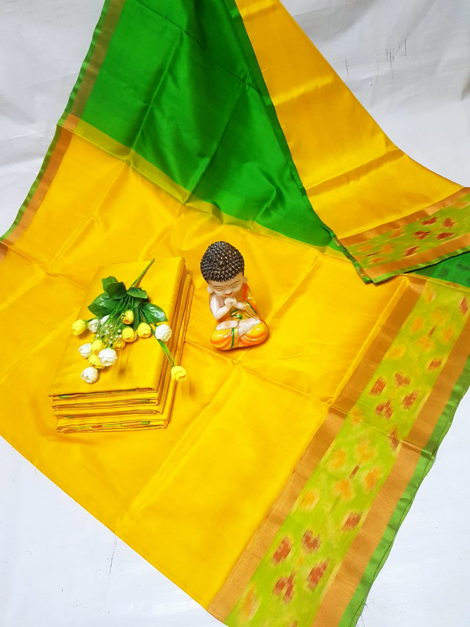 Yellow Uppada sarees with small pochampally border