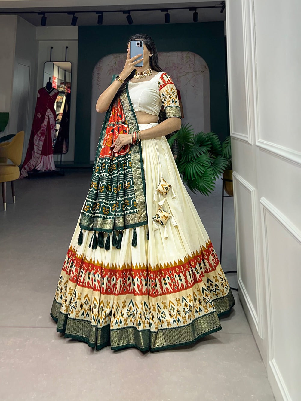 Cream and dark green lehenga choli