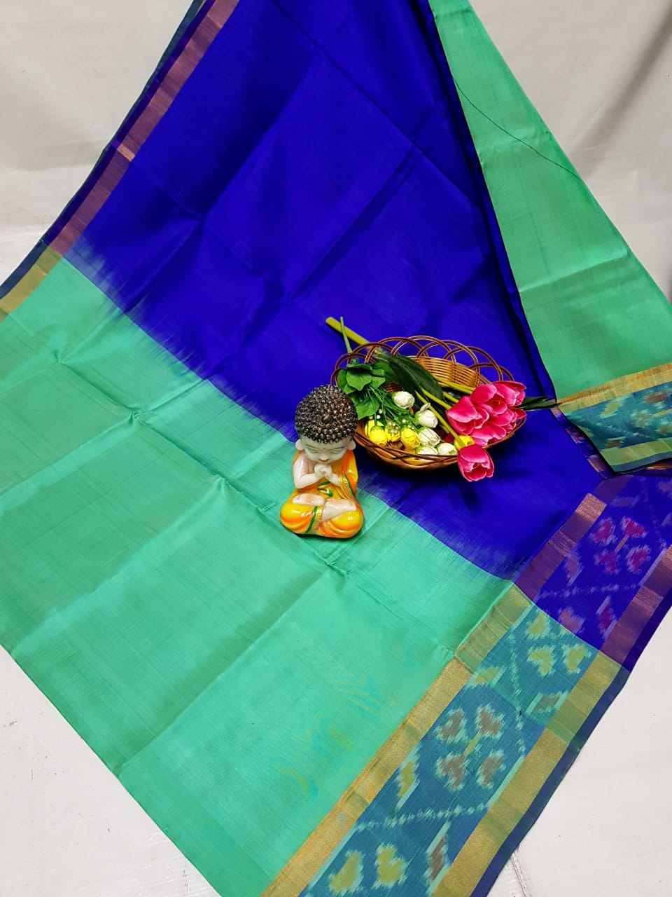 Turquoise Uppada sarees with small pochampally border