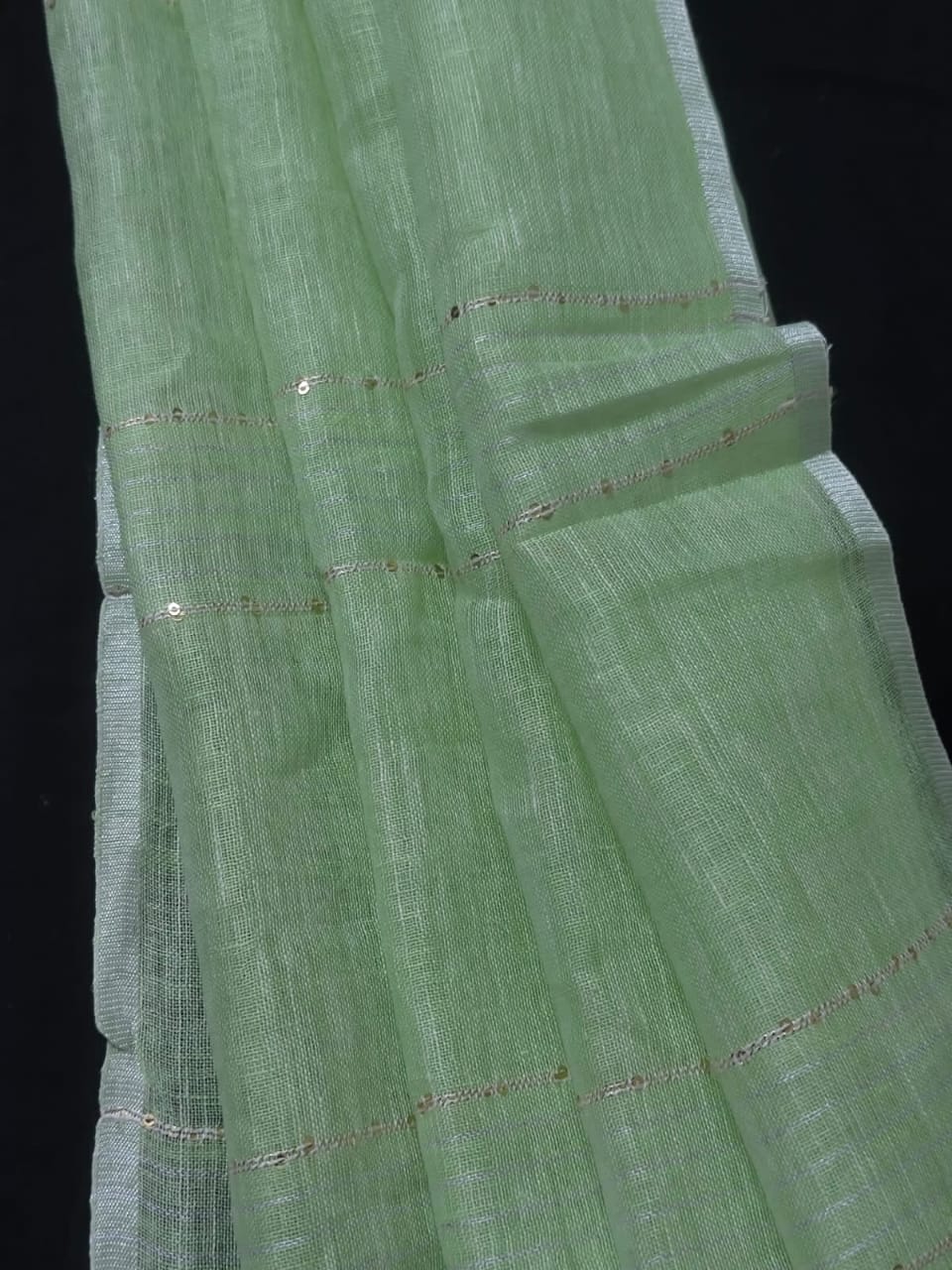 Pastel green linen striped sarees