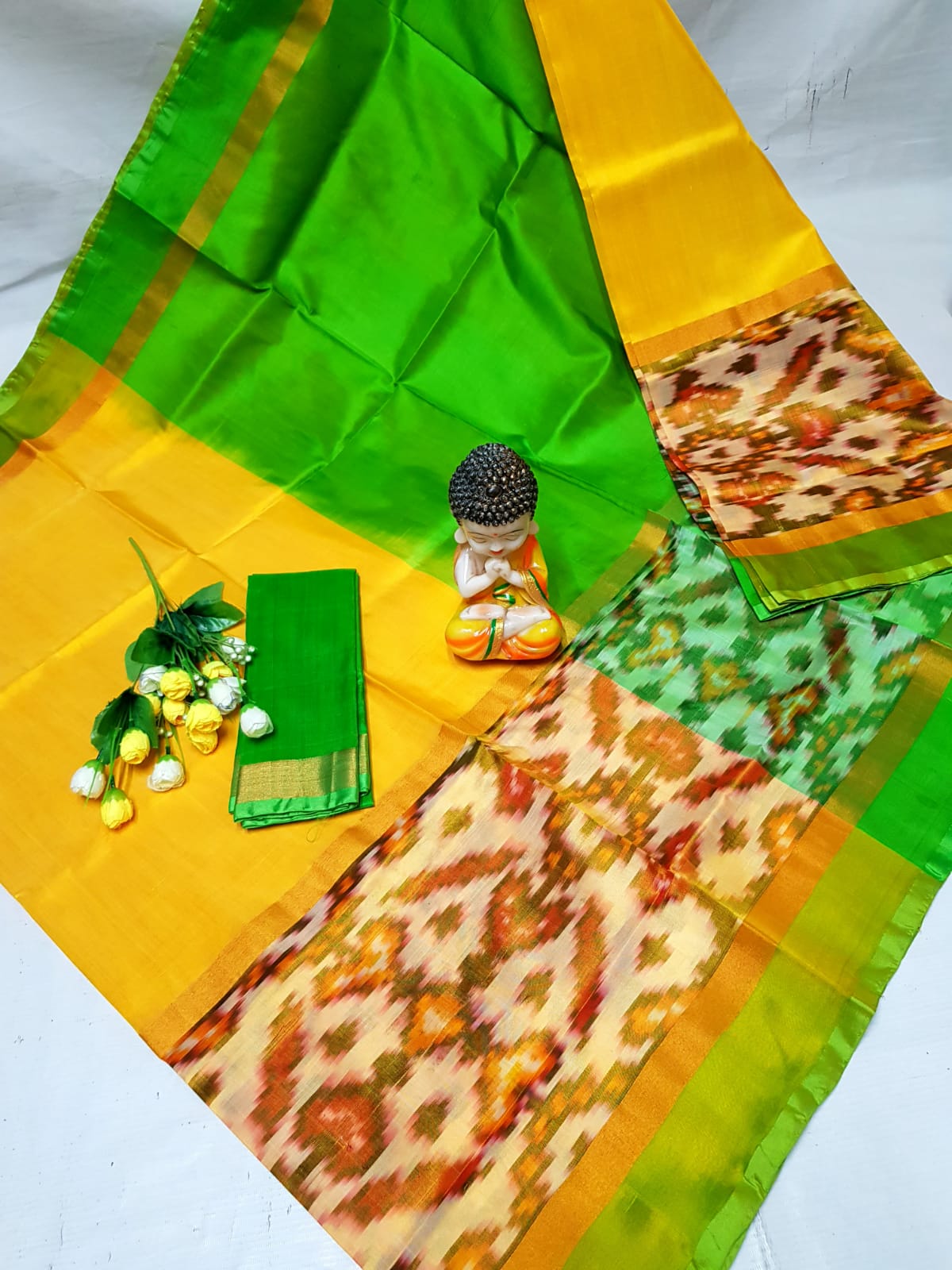 Yellow and green Uppada sarees with big pochampally border