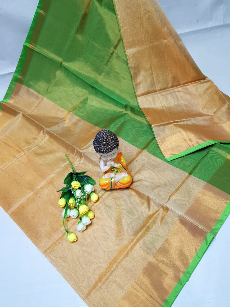 Cream and green Uppada tissue sarees