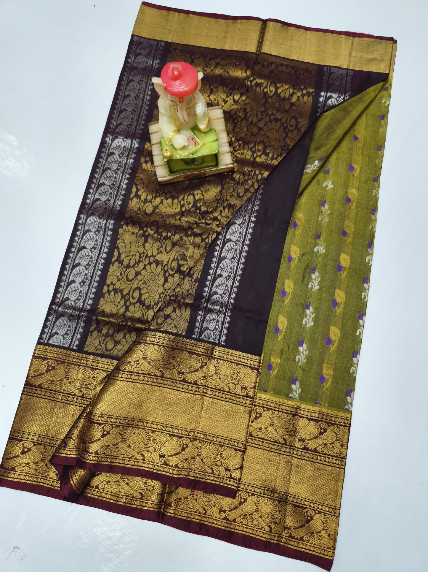 Olive green uppada silk sarees with kanchi border