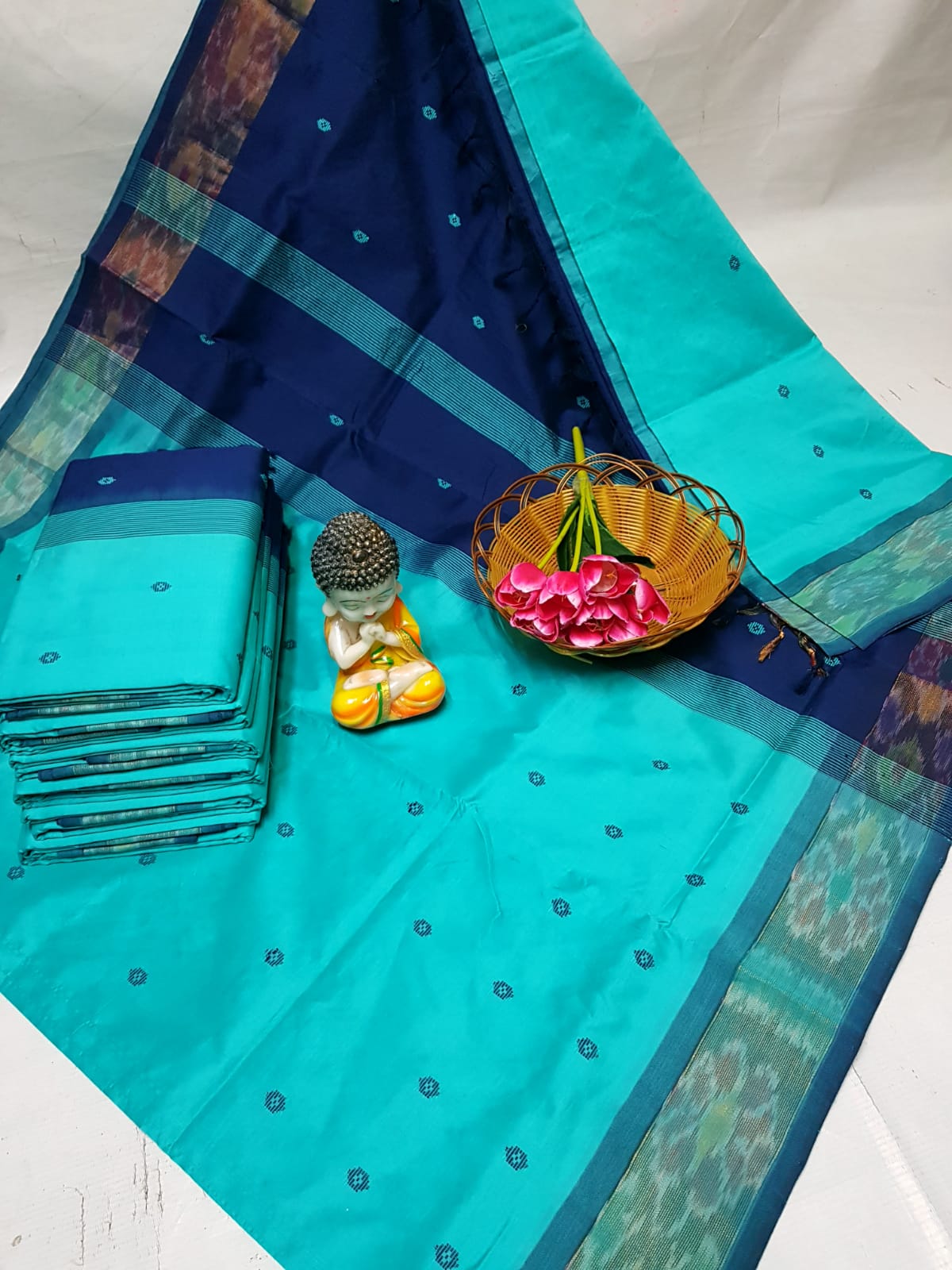 Turquoise Tripura silk sarees with Pochampally border