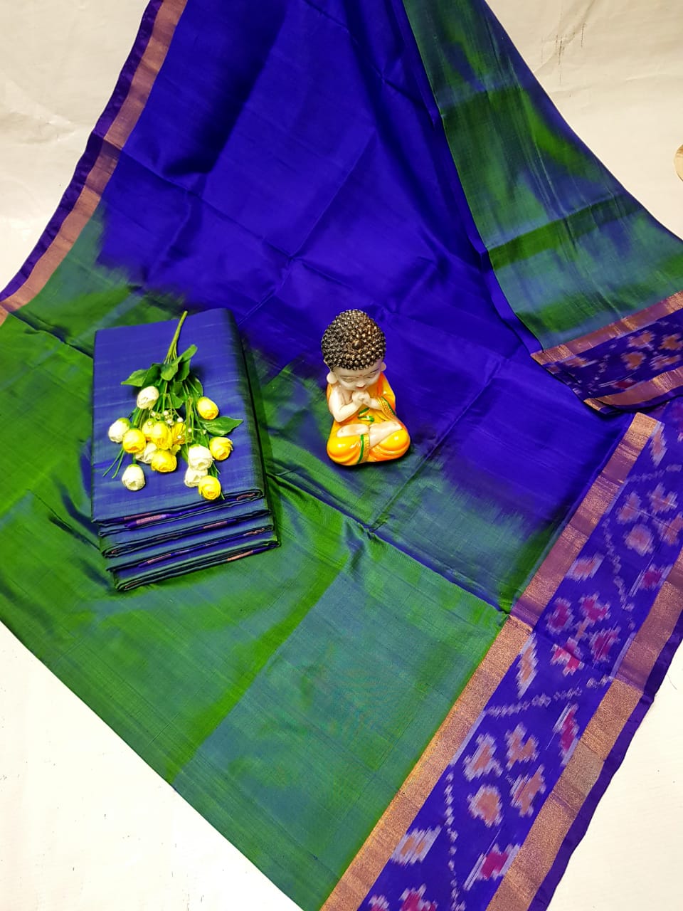 Green and dark blue Uppada sarees with small pochampally border