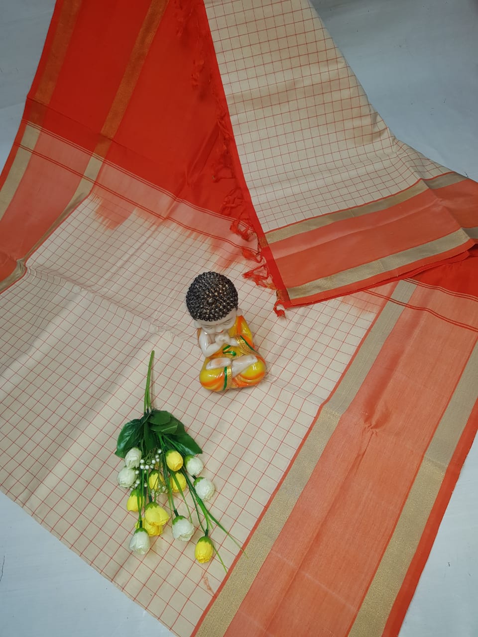 Cream and orange Tripura silk mahanati checks sarees