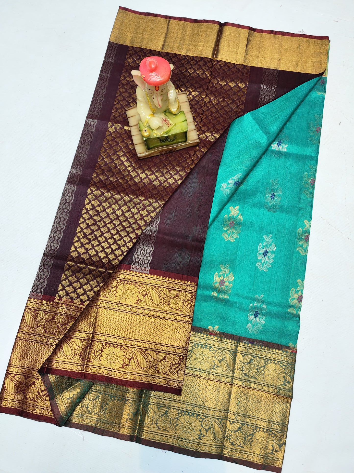 Sea green and dark brown uppada silk sarees with kanchi border