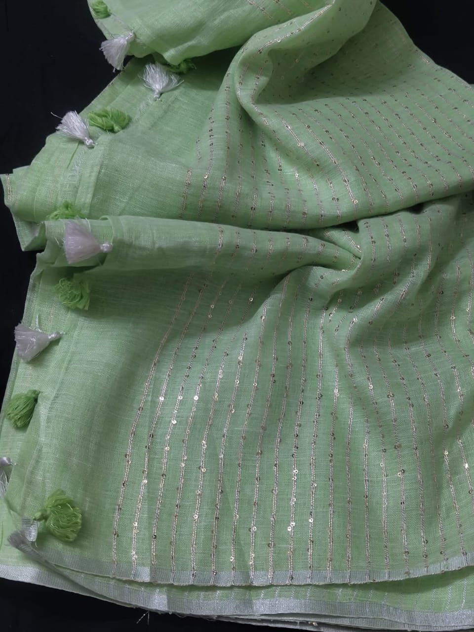 Pastel green linen striped sarees