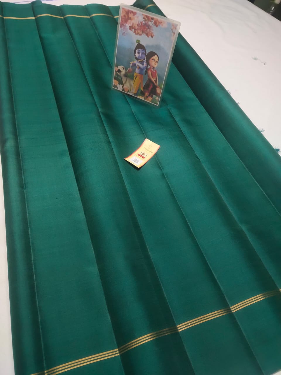 Dark green Pure kanchipuram plain silk sarees