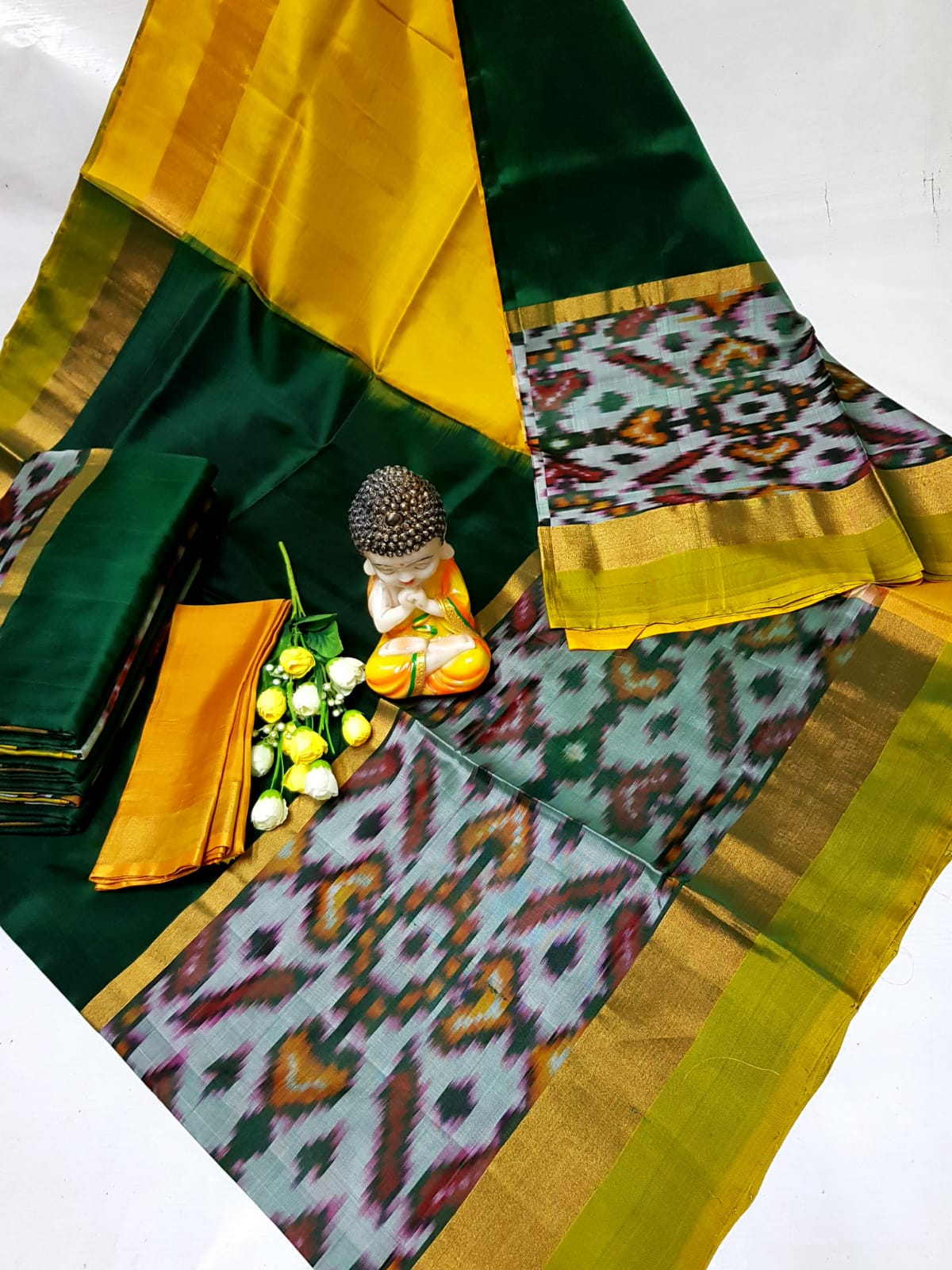 Bottle green and yellow Uppada big pochampally border sarees