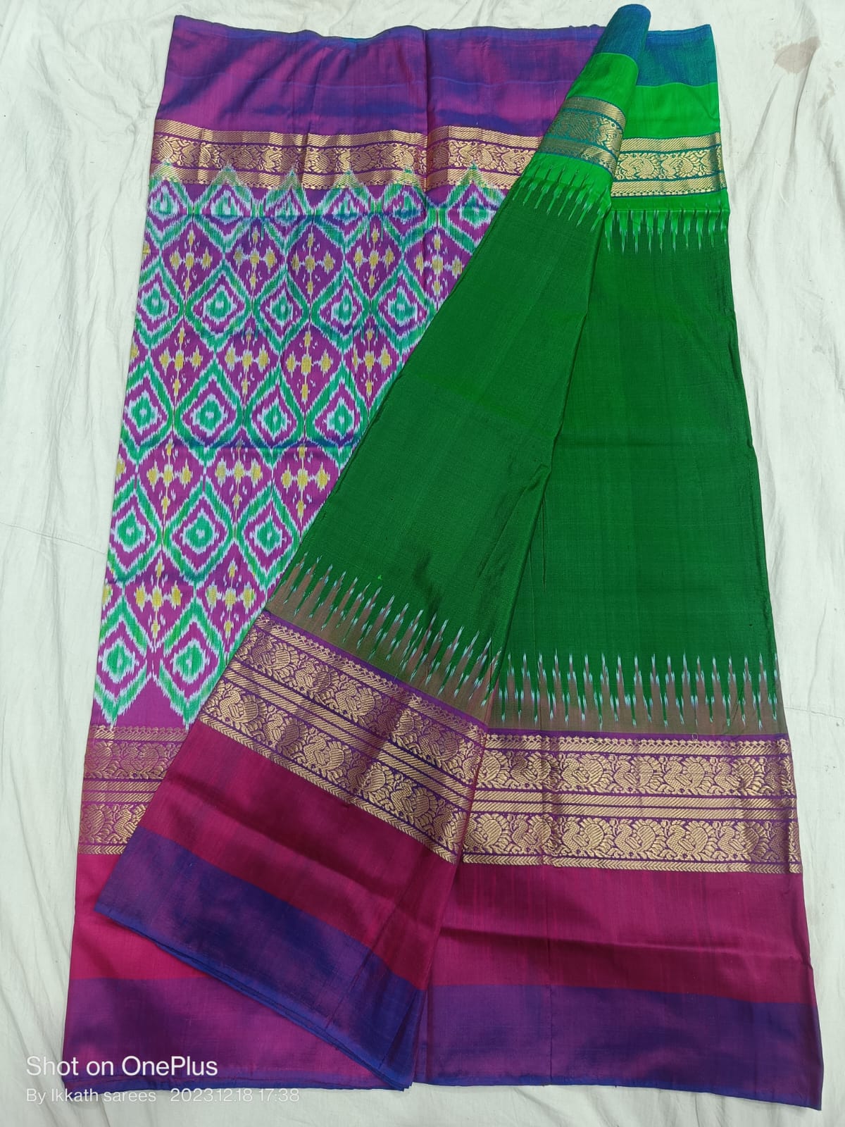 Dark green ikkat silk sarees with jakat kanchi border