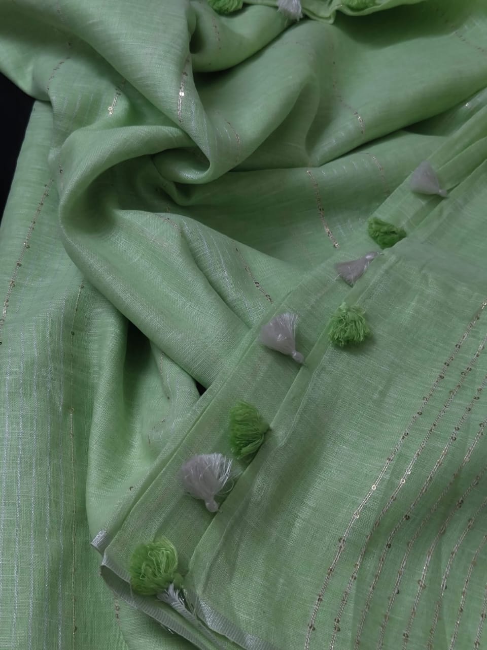 Pastel green linen striped sarees