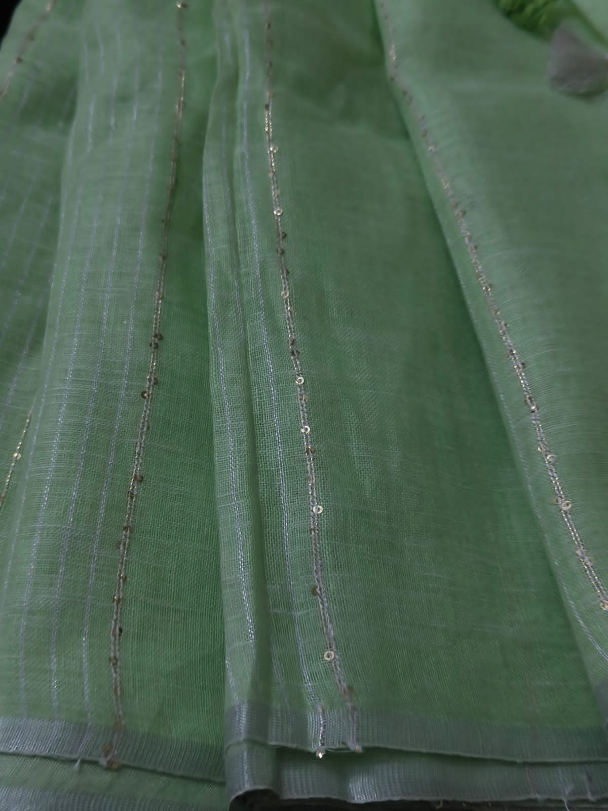 Pastel green linen striped sarees