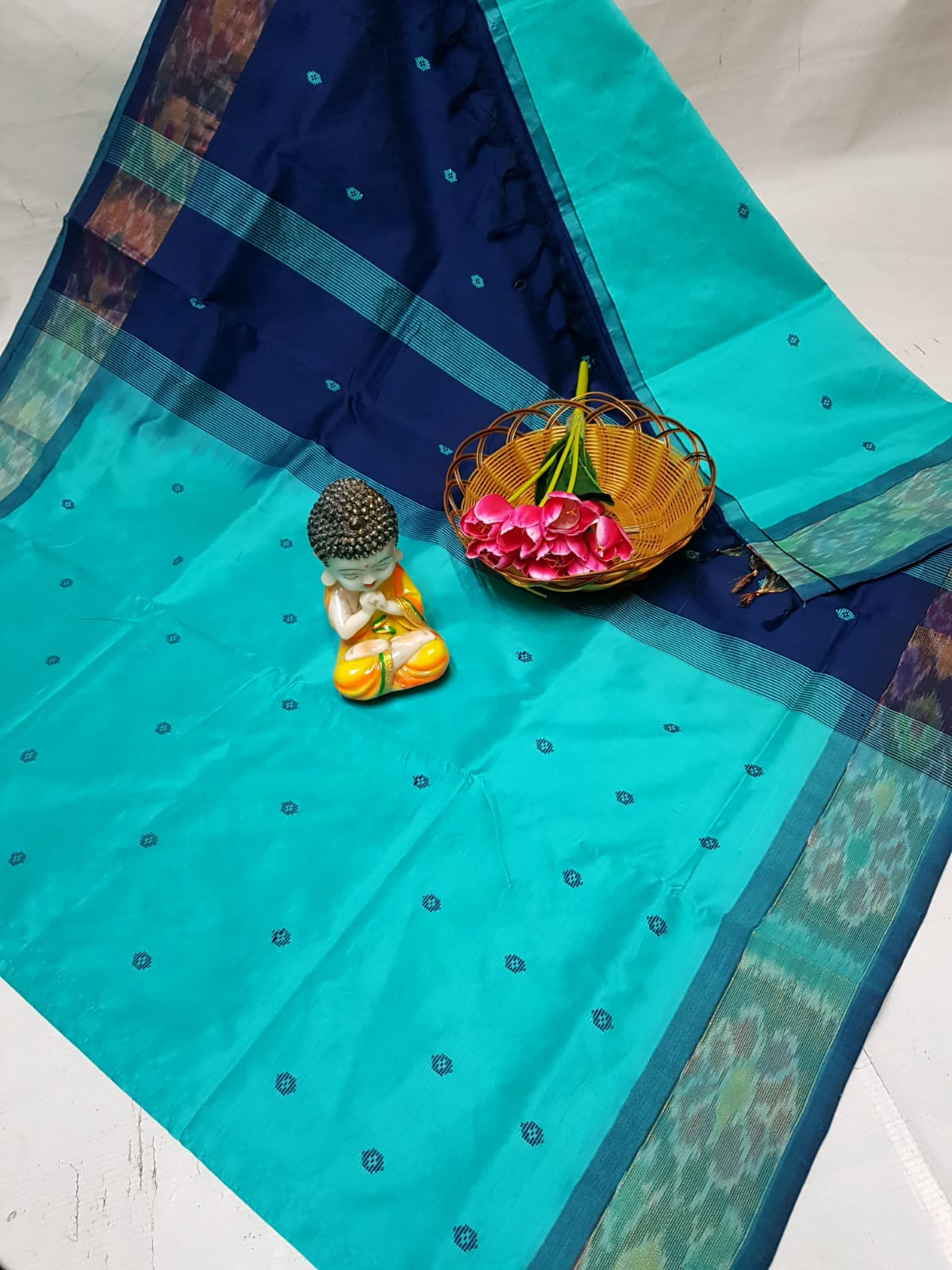 Turquoise Tripura silk sarees with Pochampally border