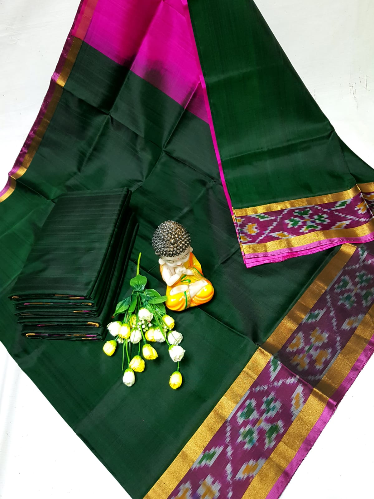 Dark green Uppada sarees with small pochampally border