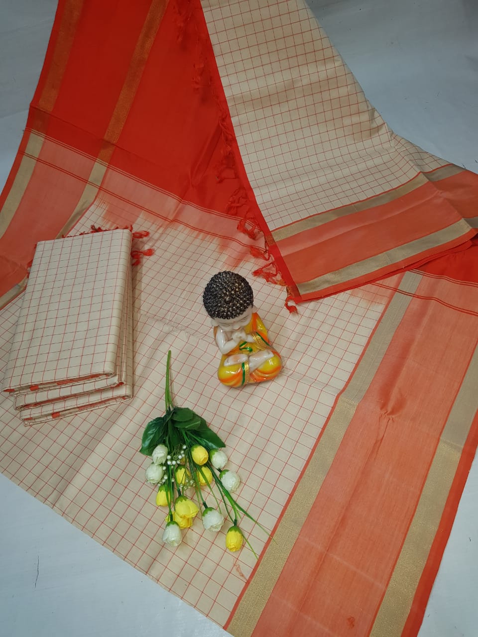 Cream and orange Tripura silk mahanati checks sarees